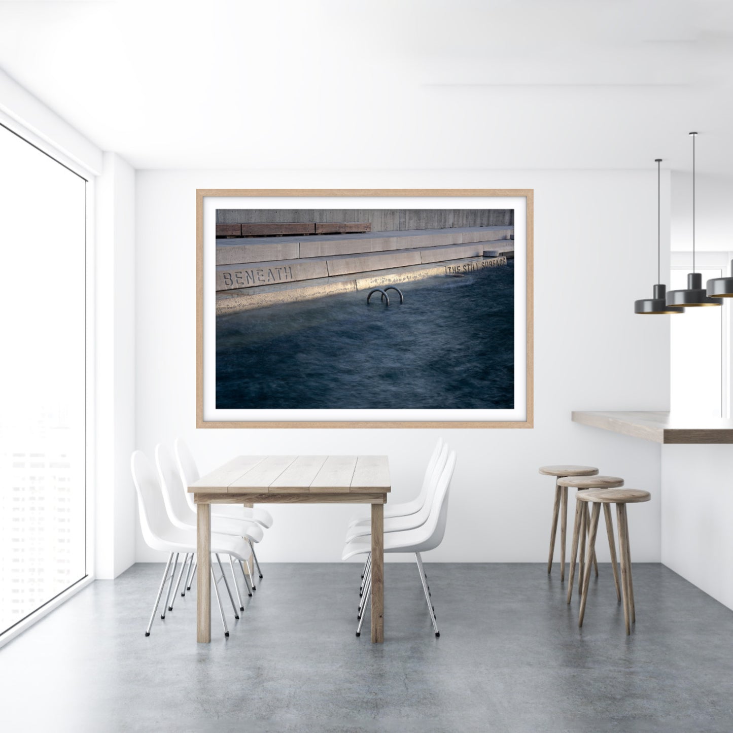 Framed fine art abstract photograph of a still water surface in a dining room setting.