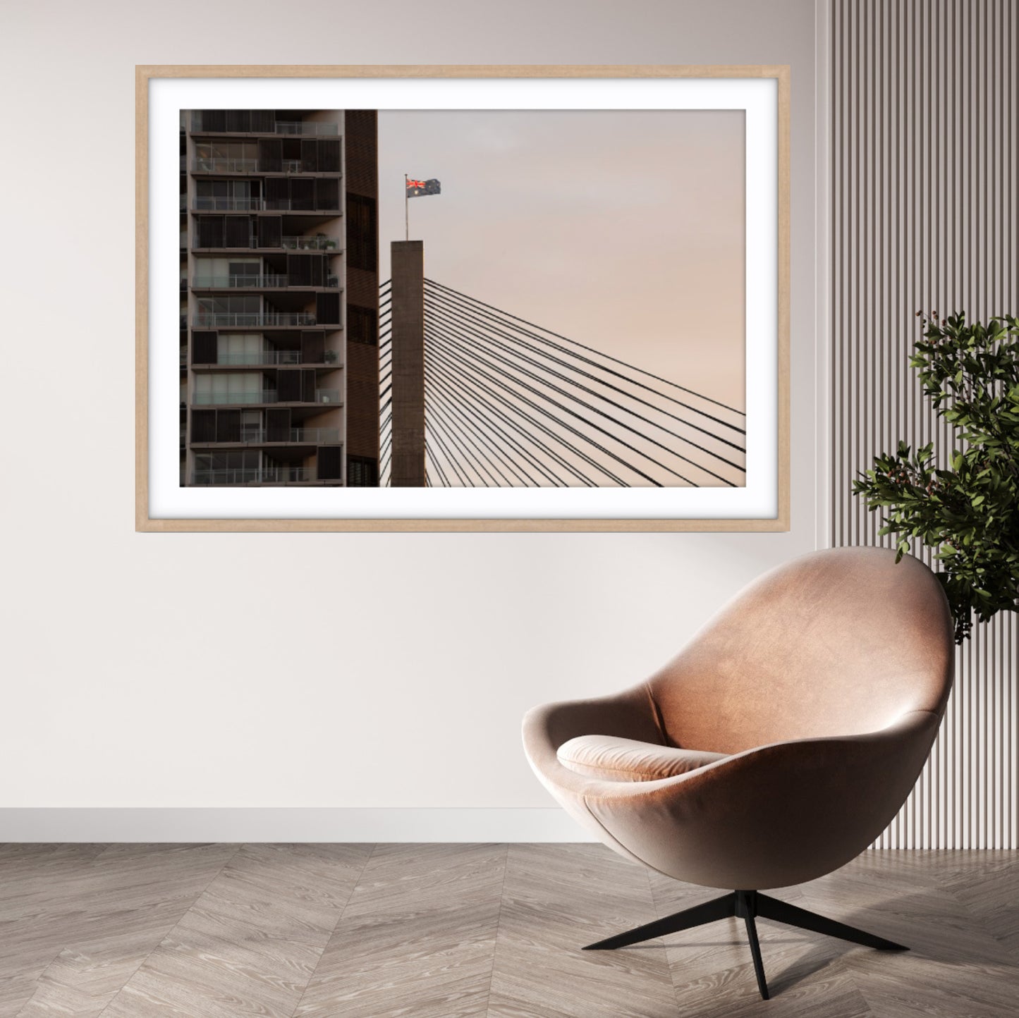 Framed fine art photograph of Anzac Bridge with Australian Flag, with a modern chair and plant in a room.