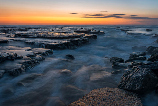 Turimetta Beach Sydney sunrise with rock formations golden light and dramatic coastal landscape
