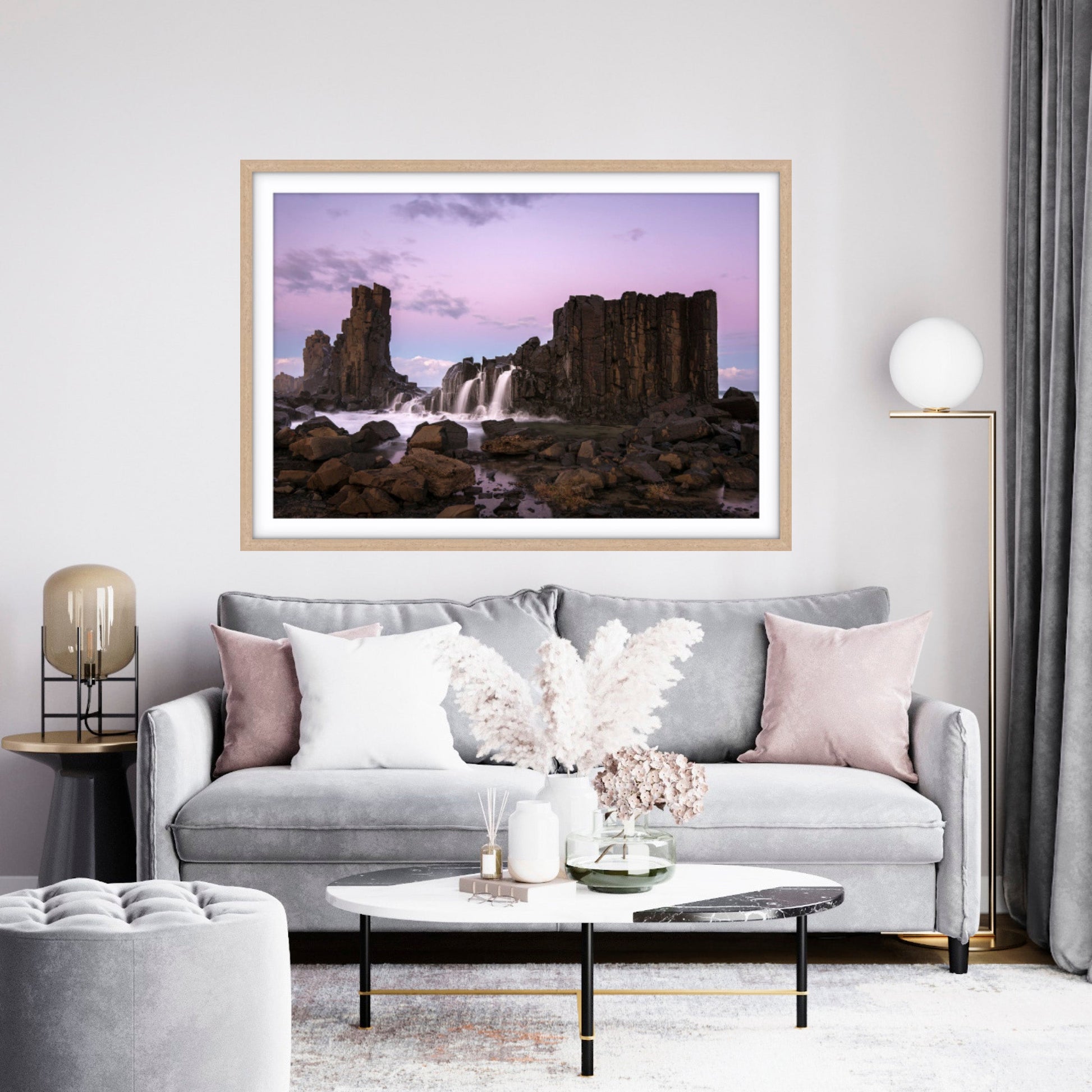 Living room with framed fine art photograph of Bombo Quarry with lavender tones. 