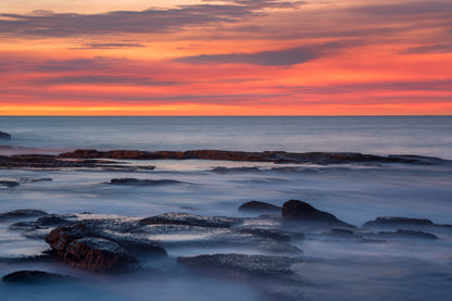 Abstract seascape photography Sydney with flowing water soft textures warm salmon and cool blue tones
