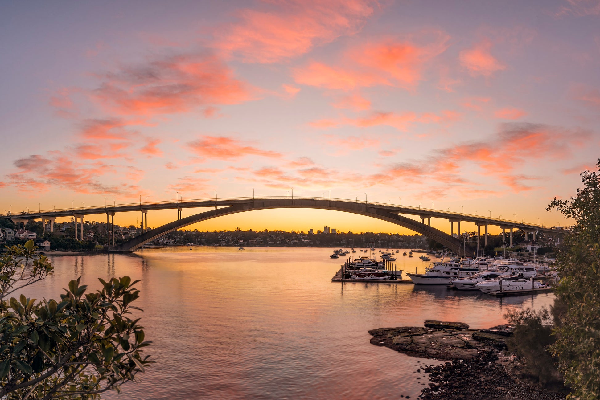 Fine art color photograph of Gladesville Bridge sunrise warm clouds Inner West Sydney