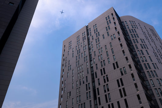 Color photograph passenger jet Sugar Dock Silk towers Jacksons Landing Pyrmont twilight blue sky Sydney architecture