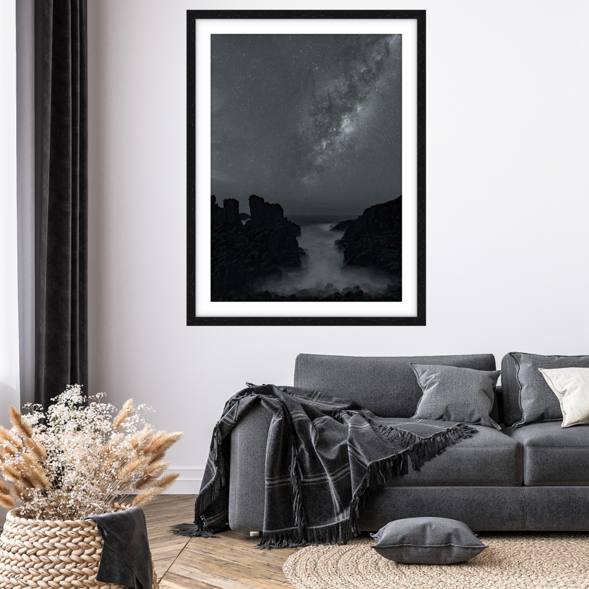Framed fine art astrophotography print in black and white with Milky Way and Bombo Quarry, Kiama, NSW foreground in a living room.
