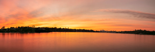 Parramatta River Breakfast Point Sydney panoramic dawn with golden light silken water and CBD silhouette