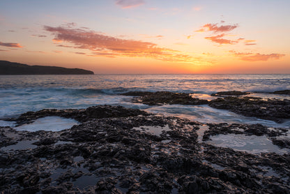 Killalea Beach sunrise South Coast NSW with apricot glow golden light and serene ocean landscape