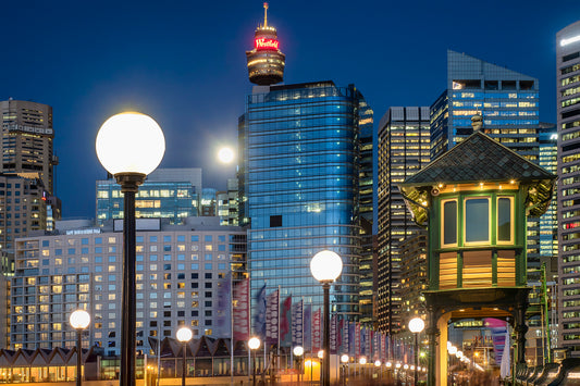 Color photograph of full moon rising over Pyrmont Sydney Harbour cityscape dramatic sky