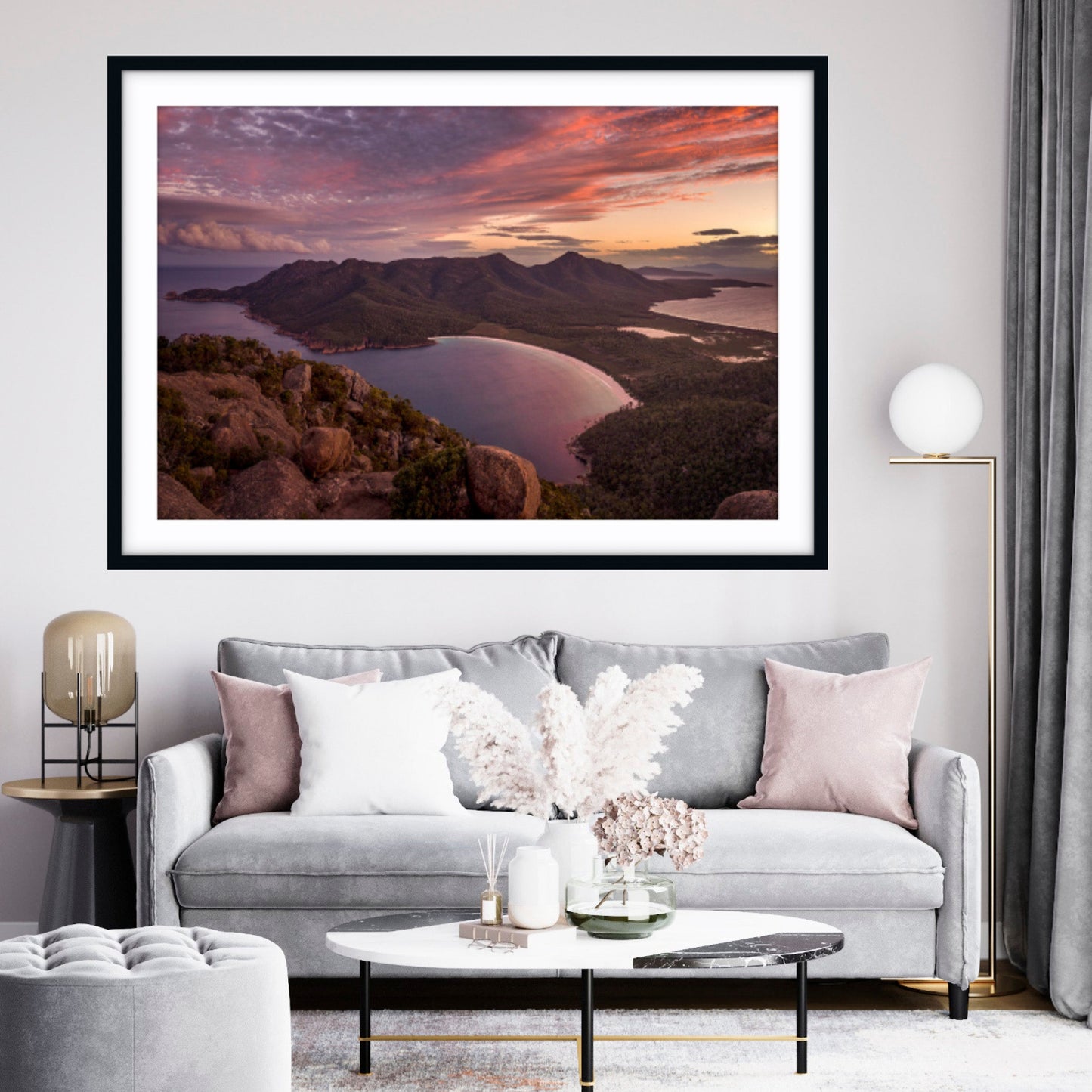 Framed fine art landscape print from Mt Amos overlooking Wineglass Bay, Tasmania at sunset in a living room.