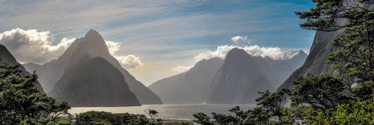 Milford Sound New Zealand panoramic fjord landscape with towering granite peaks and tidal waters