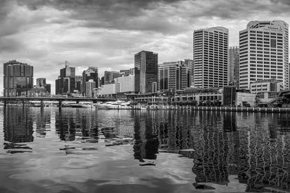 Black and white photograph of dramatic cumulus clouds over Darling Harbour Sydney cityscape from Pyrmont