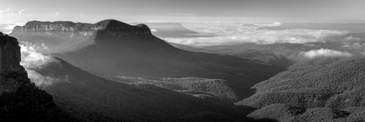 Black and white photograph of sunrise over Blue Mountains layered ridges from Narrowneck Katoomba