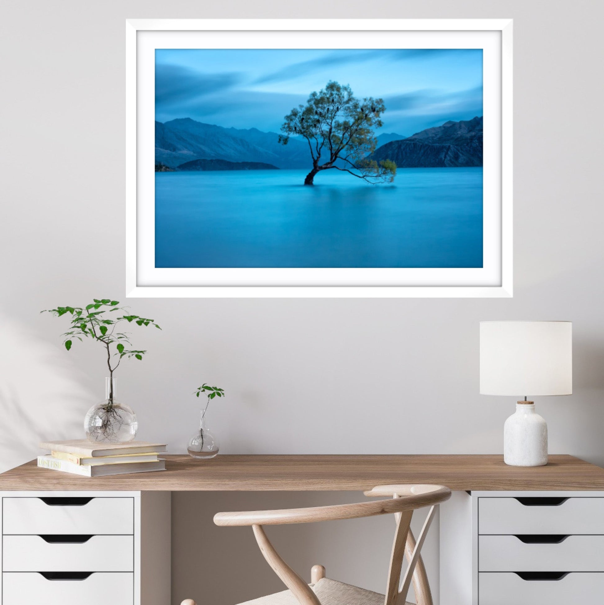 Framed fine art photograph of That Wanaka Tree, Lake Wanaka, New Zealand with a desk and chair below.