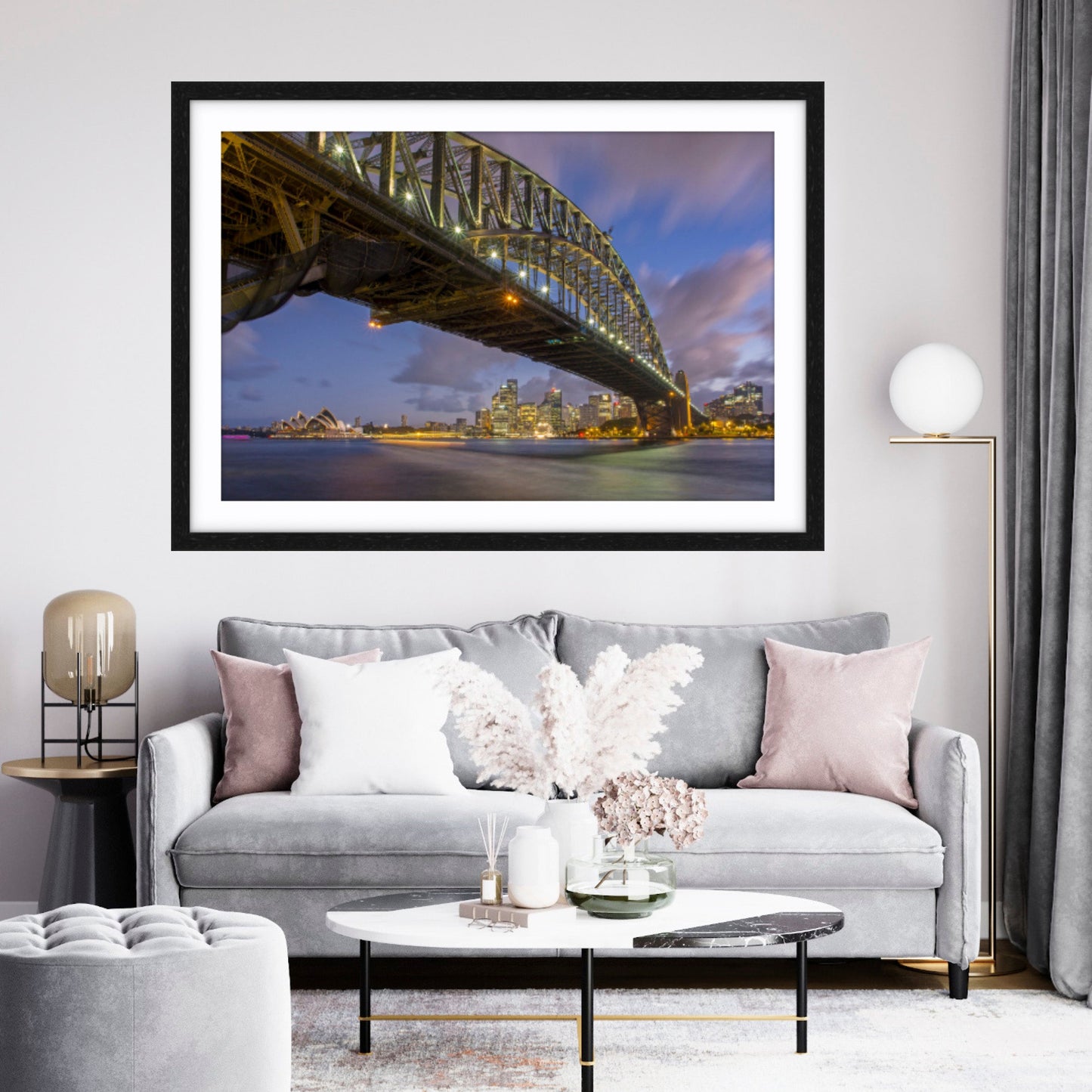 Framed artwork of a bridge over water in a living room setting.